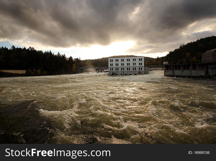 The water is flowing by the power plant.Skotfoss in south Norway