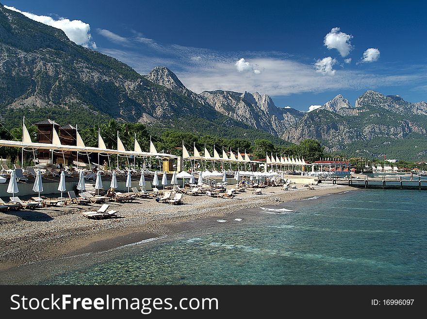 Panorama of a beach with a kind on mountains. Panorama of a beach with a kind on mountains