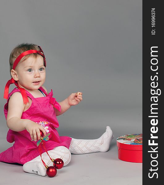 Little girl is seating and posing