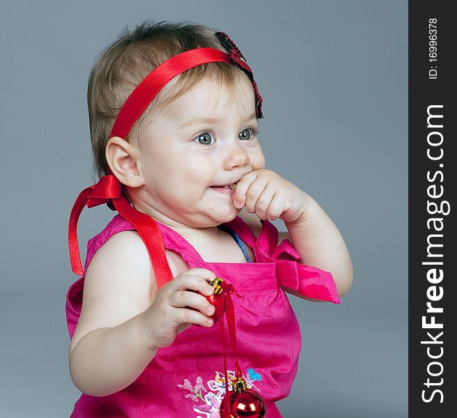 Little girl is seating and posing