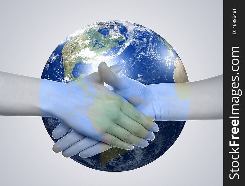 Business handshake on the background of the Earth. The symbol of a successful business.