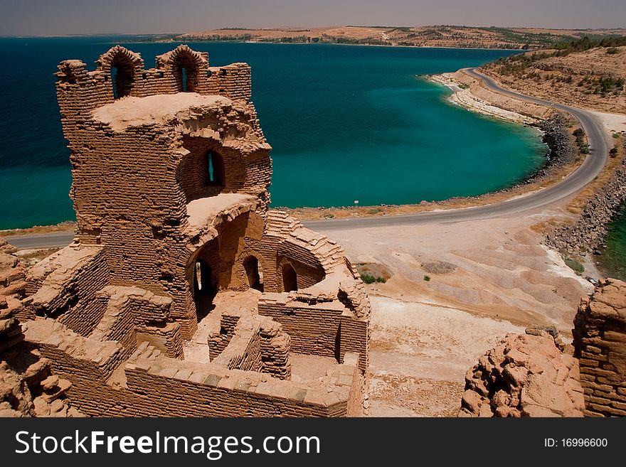 Ruins of Syrian castle Qalat Jabar surronuded by Asad lake.