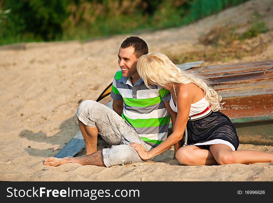 Couple laughing on the beach. Couple laughing on the beach