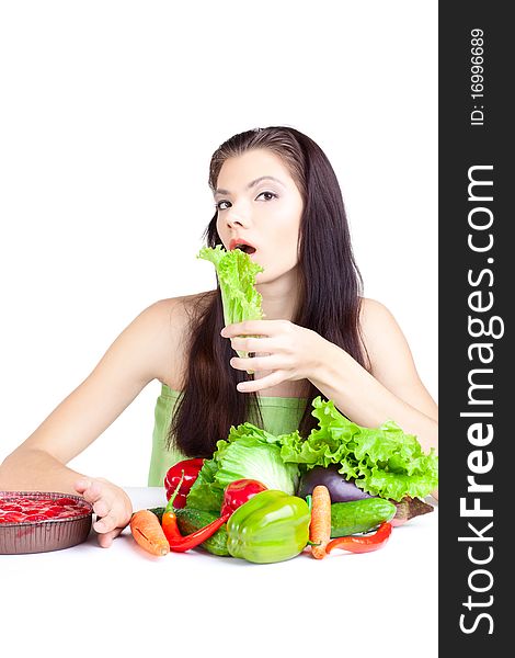 Young girl with vegetables over white background. Young girl with vegetables over white background