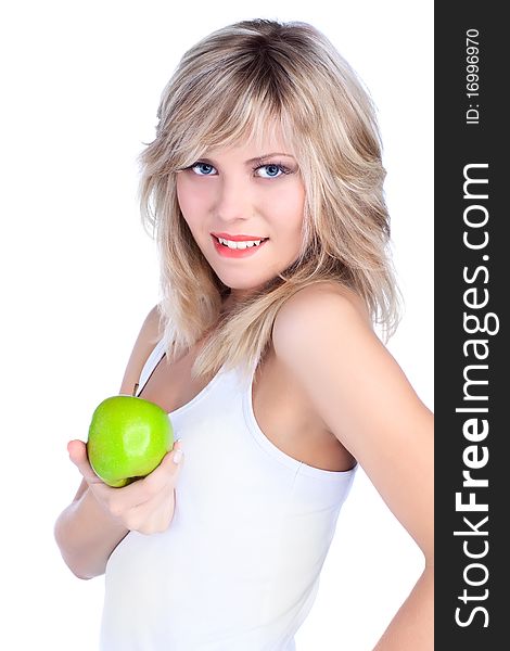 Young girl over white background with apple. Young girl over white background with apple