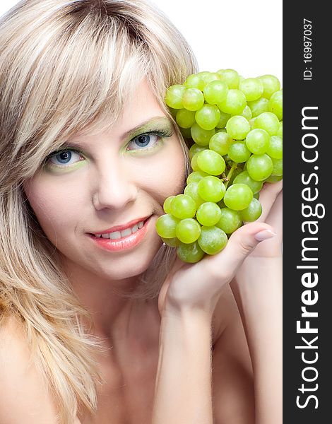 Beautiful woman over white background with grape. Beautiful woman over white background with grape