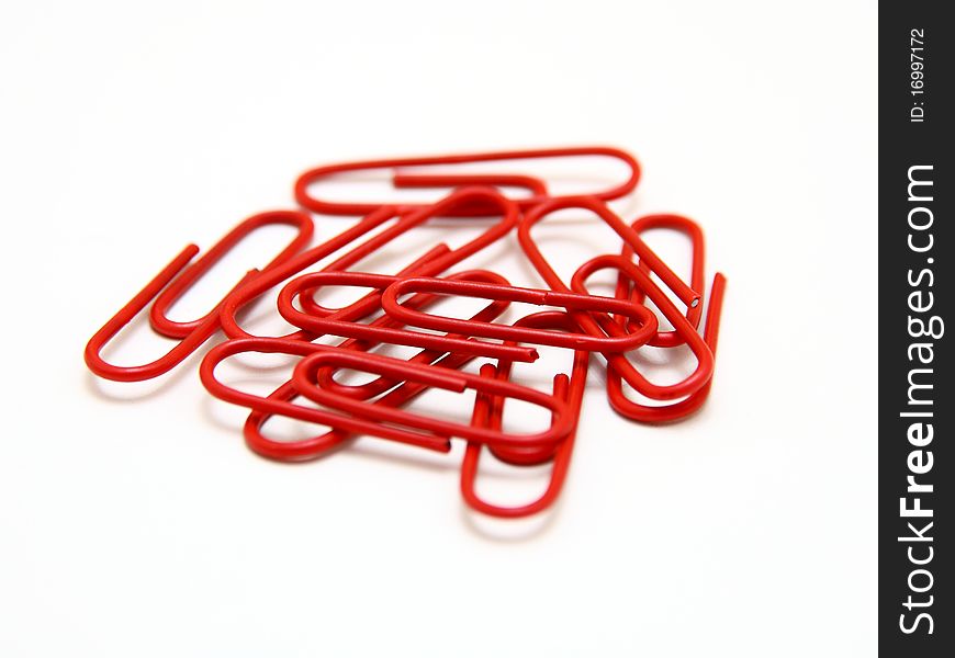 Color paper clips to background. Isolated on white background