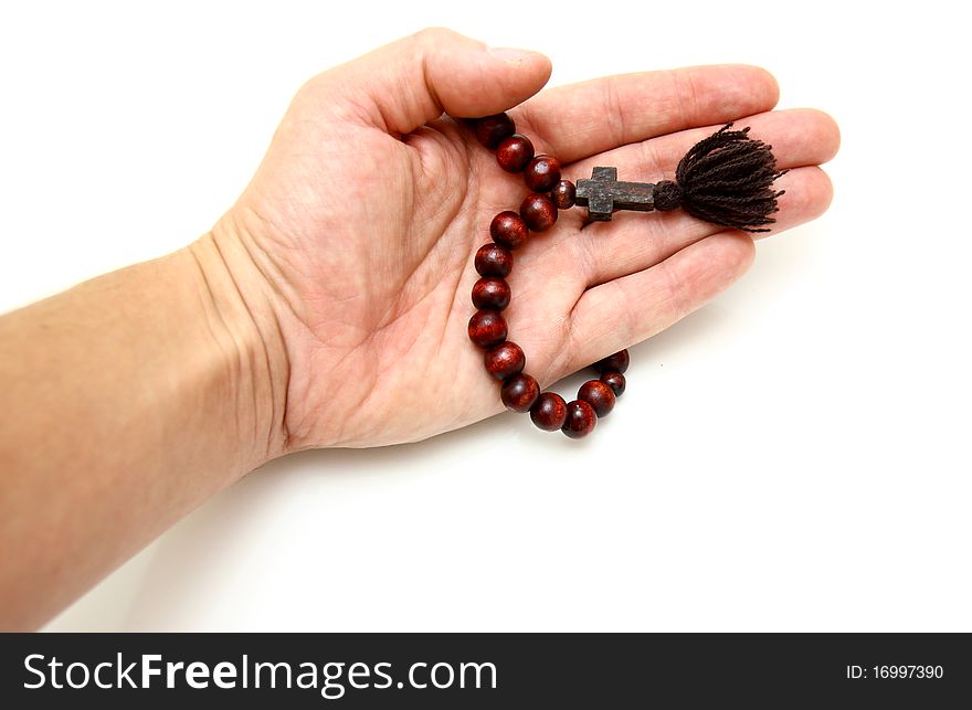 Bead-roll with wooden elements isolated on white background In a hand. Bead-roll with wooden elements isolated on white background In a hand