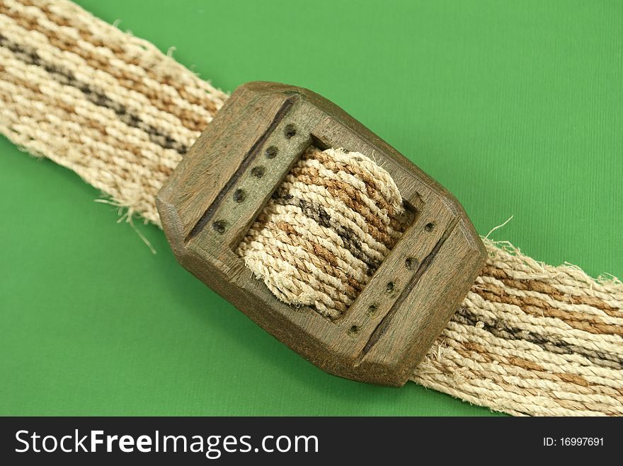 Women's belt on top of a green background