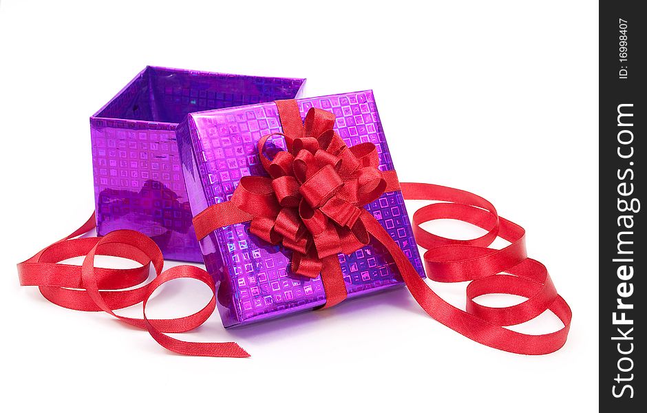 Gift box with red bow on white