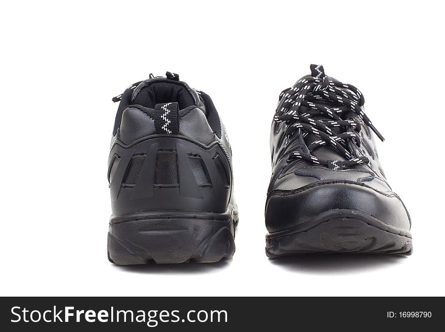 Black leather shoes on a white background