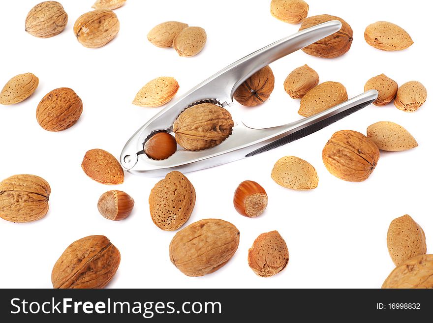 Walnut In A Nutcracker On White Background