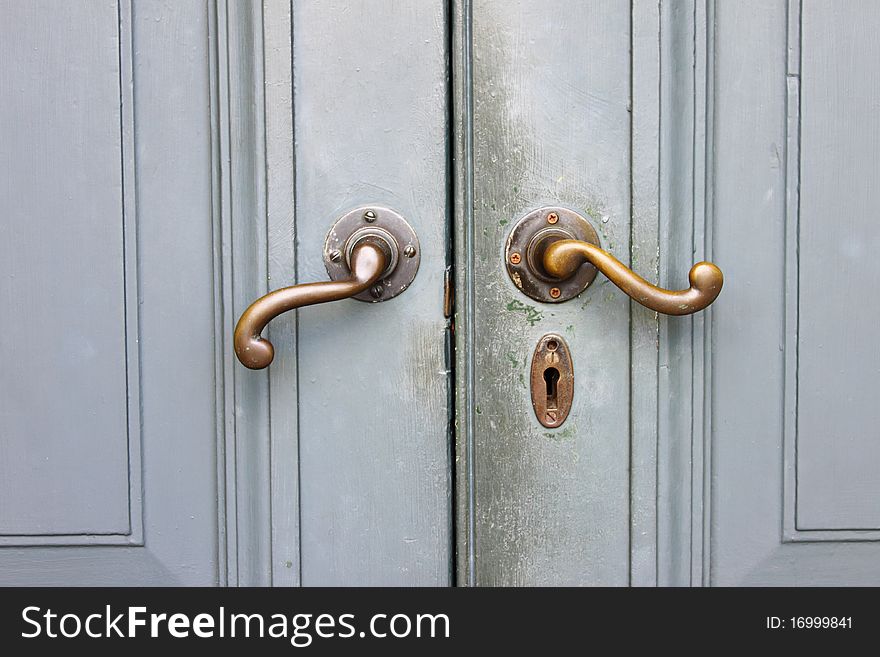 A door knob on blue door.