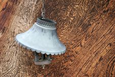 Old Broken Lamp Against Wooden Wall Stock Photography