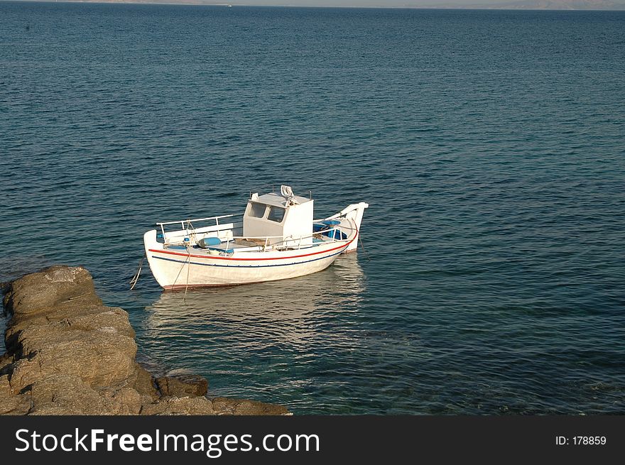 A greek fishing boat with reflection