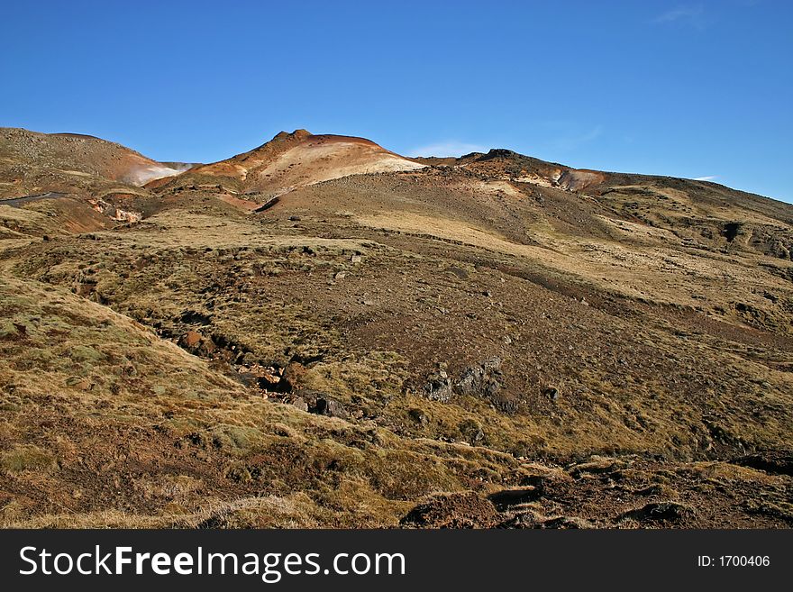 Icelandic barren landscape with blue sky. Icelandic barren landscape with blue sky