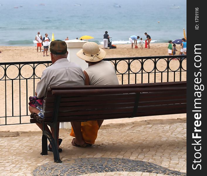 Old couple watching the sea