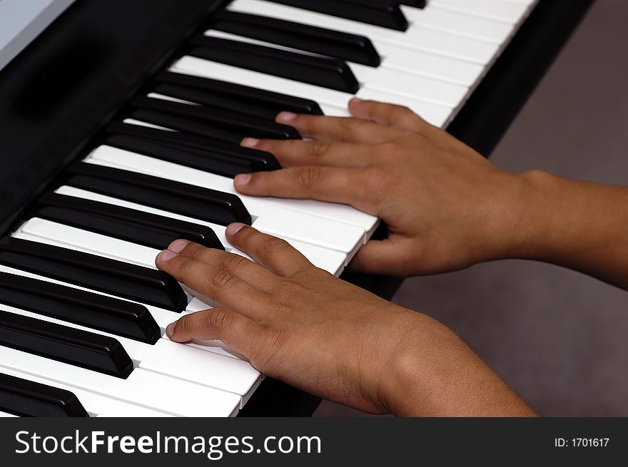 Two hands playing the piano