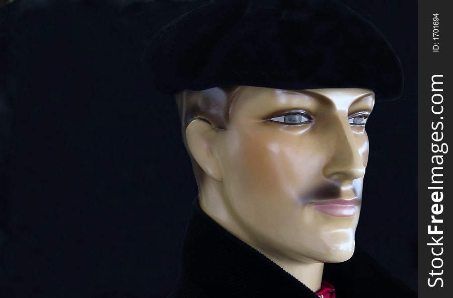 A head of a man with a black beret a french classic. A head of a man with a black beret a french classic