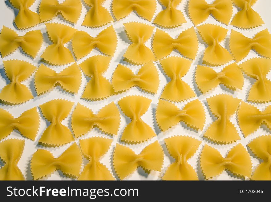 Farfalle pasta organized and isolated on white