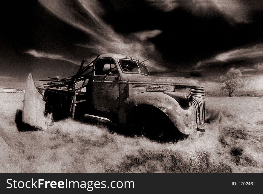 Old derelect truck in barren landscape, infra red. Old derelect truck in barren landscape, infra red