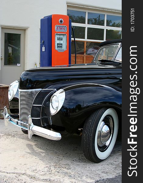 Classic car and old gas pump, nostalgic. Classic car and old gas pump, nostalgic