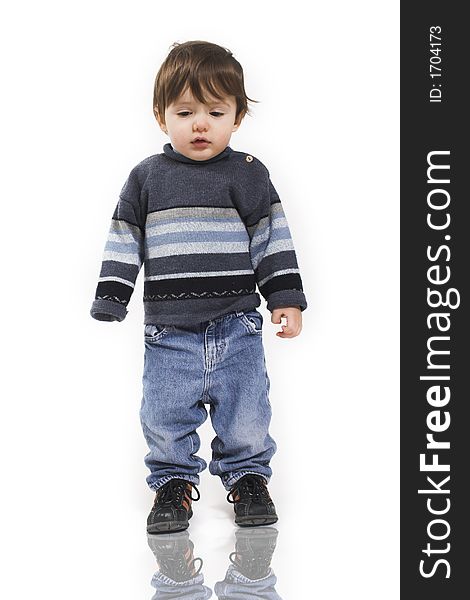 Baby standing with reflection over white background. Baby standing with reflection over white background