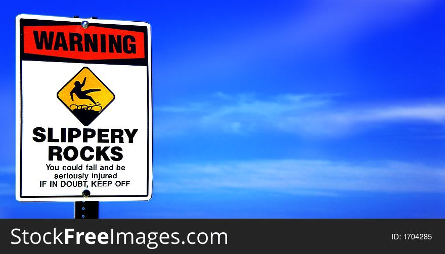 Digital photo of WARNING SIGN with bright blue sky in Hawaii. Digital photo of WARNING SIGN with bright blue sky in Hawaii.