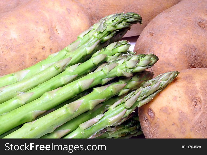 This is a close-up image of asparagus and potatoes.