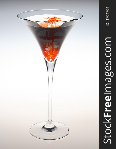 Tall martini glass with red splater color. Tall martini glass with red splater color