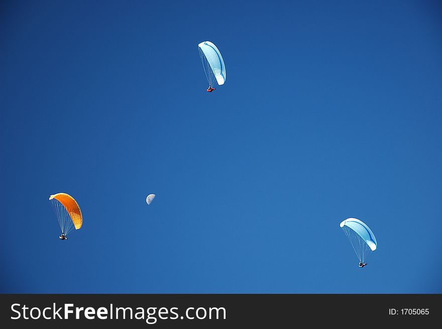 Three paragliders on perfect blue New Zealand sky. Three paragliders on perfect blue New Zealand sky