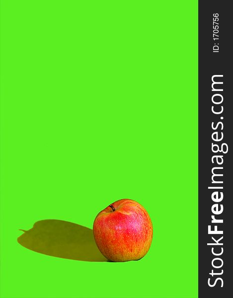 Photo of red apple on green background