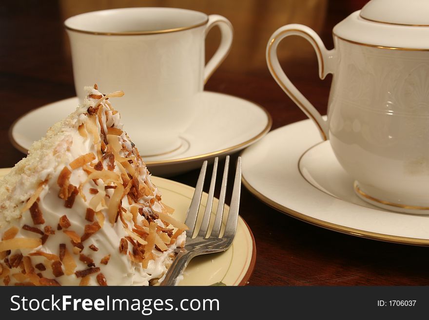 Fine china with coffee & toasted coconut cake. Fine china with coffee & toasted coconut cake