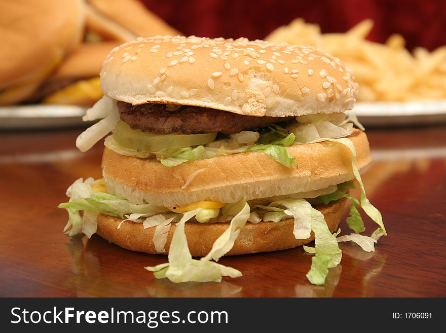 Shot of fast food cheeseburger & fries shot up close. Shot of fast food cheeseburger & fries shot up close
