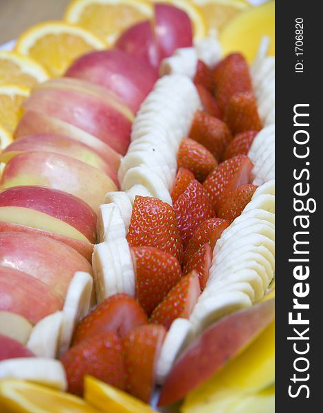 Assorted fruit arranged on a serving plate at holiday table. Assorted fruit arranged on a serving plate at holiday table