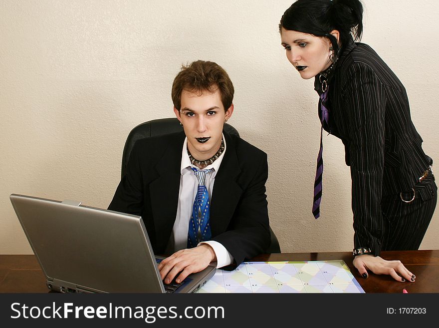 Goth twenty something business team with laptop. Goth twenty something business team with laptop.