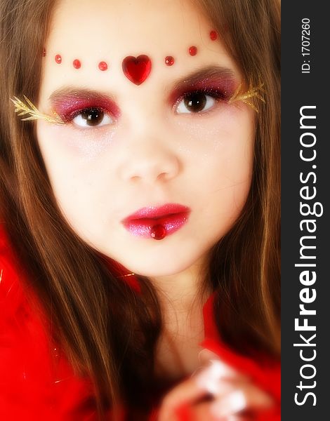 Child dressed in Christmas or Valentine's Day costume make-up. Child dressed in Christmas or Valentine's Day costume make-up.