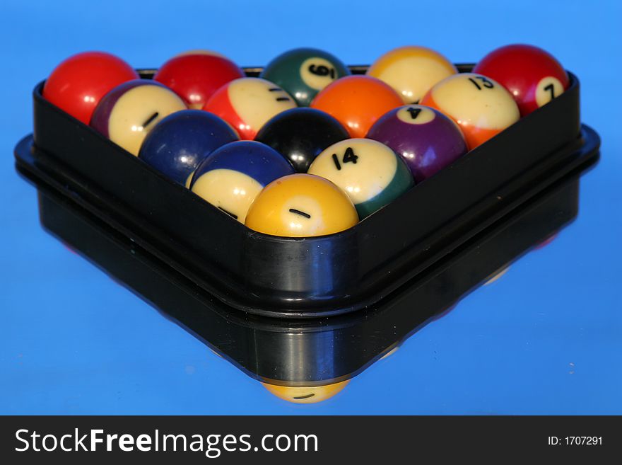 Shot of pool balls on blue background