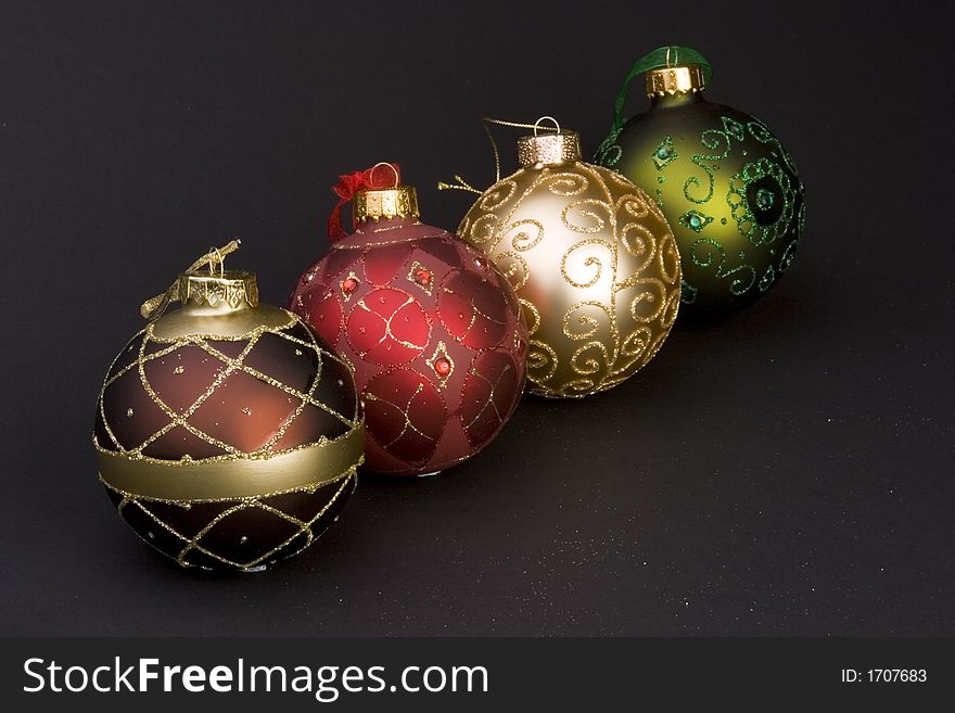 Detail of Christmas balls against a plain background.