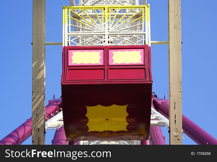 Colorful large carnival ferris wheel carriage