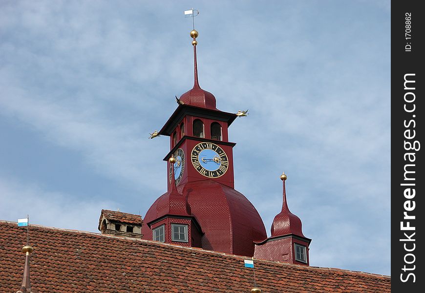 A view of an old church town and clock in the old part of Luceerne Switzerland. A view of an old church town and clock in the old part of Luceerne Switzerland.