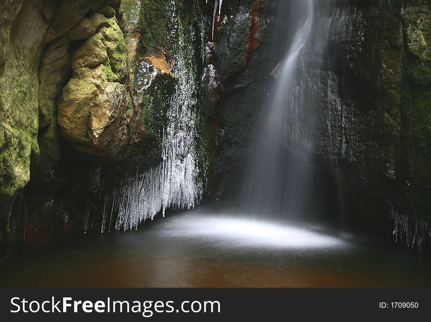 Moving water with ice in the Adr rocks in the Czech Republic