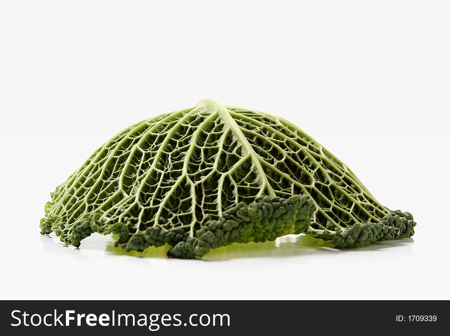 Green cabbage leaf over white background. brassica oleracea