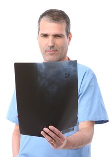 Doctor Looking At A Xray Royalty Free Stock Images
