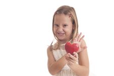 Girl Holds Red Heart In Her Hands Stock Photo