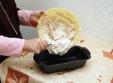 Putting A Dough Into A Cake Pan Royalty Free Stock Photo Putting A Dough Into A Cake Pan Royalty Free Stock Photo