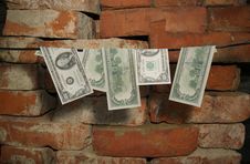 Dollars Hang On A Rope Royalty Free Stock Photo