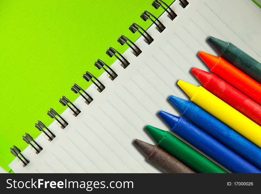 Isolated green notebook on white.