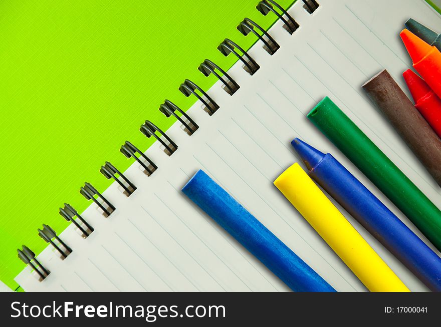 Isolated green notebook on white.