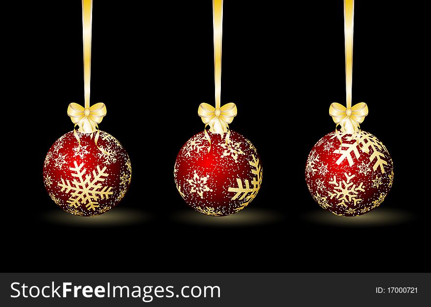 Three red Christmas spheres on a black background